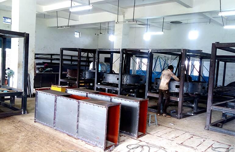 a man working in a factory at chetan agro